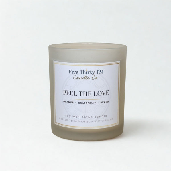 Peel the Love candle by Five Thirty PM Candle Co® in a white glass jar with fresh grapefruit fragrance notes.