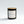 Archive No. 4 Presence candle by Five Thirty PM Candle Co® in a black glass jar with brandy, sandalwood, and leather fragrance notes.