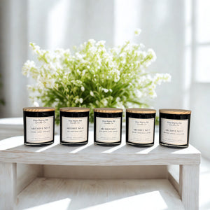 The Archive of Life candle collection featuring Archive No. 1, Archive No. 2, Archive No. 3, Archive No. 4, and Archive No. 5 candles in black glass jars with bamboo lids by Five Thirty PM Candle Co®.