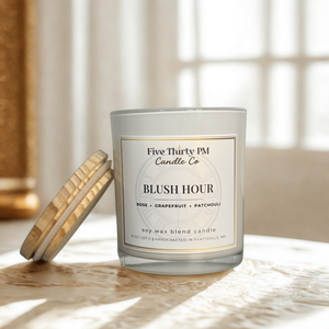 Blush Hour candle by Five Thirty PM Candle Co® in a white glass jar with wooden lid in a warm home setting, featuring rose, grapefruit, and patchouli fragrance notes.