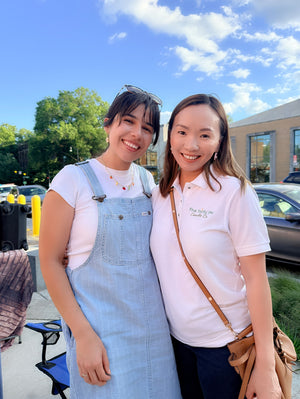 Ivy of Five Thirty PM Candle Co® with a fellow local vendor at an outdoor makers market.