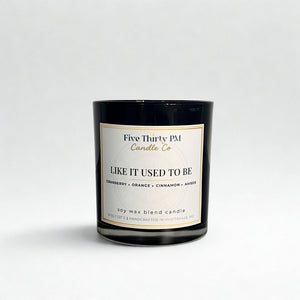 Like It Used To Be candle by Five Thirty PM Candle Co® in a black glass jar with cranberry, orange, cinnamon, and amber fragrance notes.