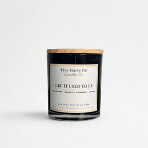 Like It Used To Be candle by Five Thirty PM Candle Co® in a black glass jar with cranberry, orange, cinnamon, and amber fragrance notes.