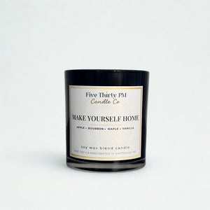 Make Yourself Home candle by Five Thirty PM Candle Co® in a black glass jar with apple, bourbon, maple, and vanilla fragrance notes.