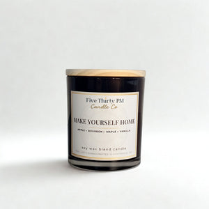 Make Yourself Home candle by Five Thirty PM Candle Co® in a black glass jar with apple, bourbon, maple, and vanilla fragrance notes.