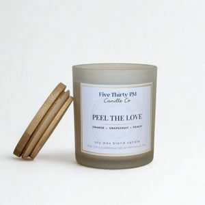 Peel the Love candle by Five Thirty PM Candle Co® in a white glass jar with a bamboo lid and grapefruit fragrance notes.