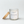 Open Peel the Love candle by Five Thirty PM Candle Co® in a white glass jar with wooden lid beside it, featuring orange, grapefruit, and peach fragrance notes.